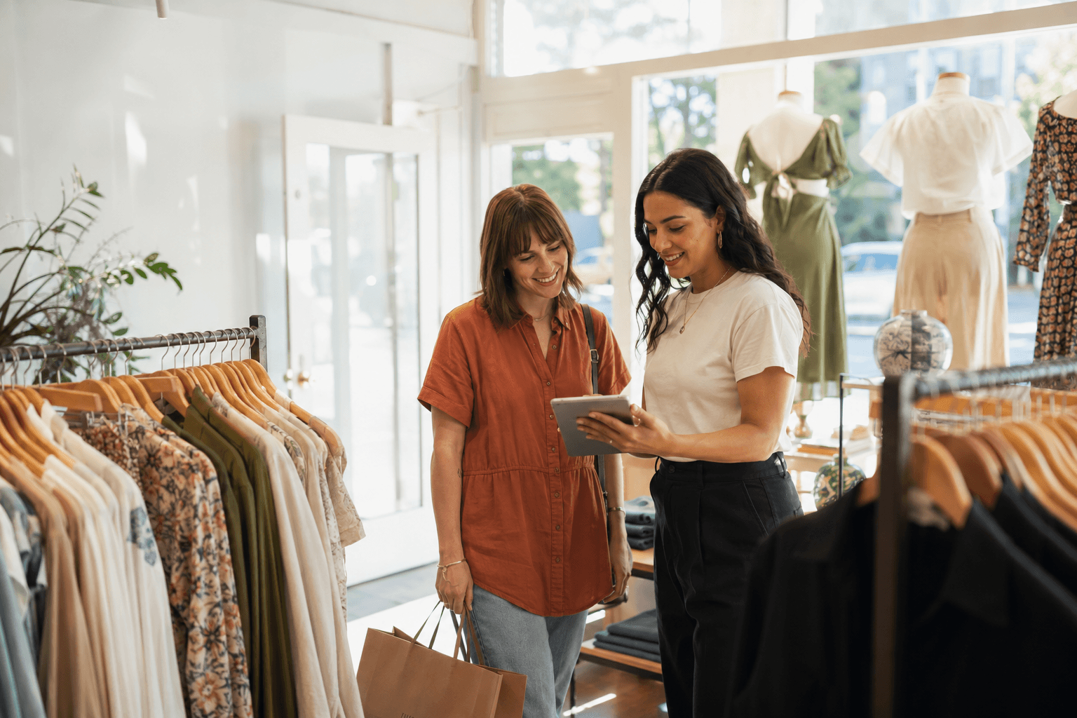 Store associate helping a customer as part of a retail clienteling program